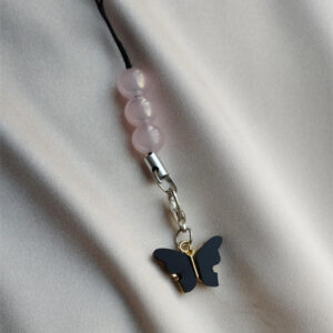 Home white butterfly phone charm.