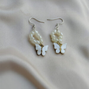 white pearly butterfly earings.